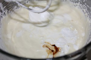 Add sour cream, whipping cream and vanilla, mixing well.