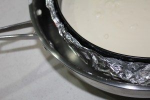 You want the water to come about an inch up the side of the pan.