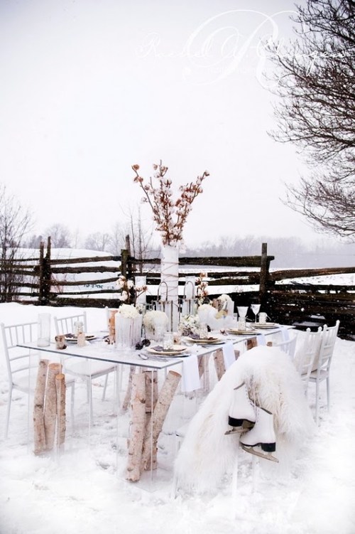 This table from Rachel A. Clingen Wedding Design is lovely, although there aren't enough layers of thermal to get me to sit outside and dine.