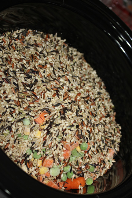 Add rice and frozen veggies.