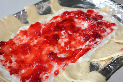 Layer on strawberry jam.