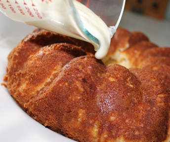 Nuke frosting for about 12 seconds then pour over cake.