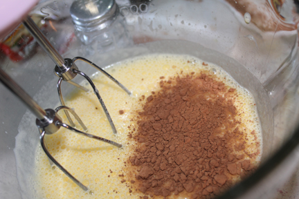 Mix in melted butter, then sugar, cocoa and chopped chocolate.