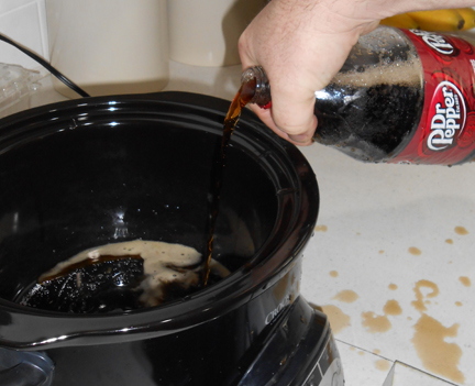 Finish adding honey, the rest of the barbecue sauce, liquid smoke and Dr. Pepper. (Don't be like us and drop the bottle of pop then open it and have it spray all over the kitchen.)