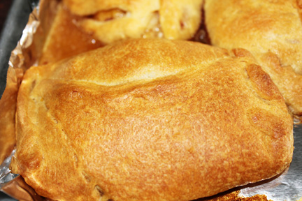 Bake at 350 degrees for about 10 minutes, until crescent dough is golden bread and juice is bubbling from the cracks you didn't quite get sealed (should you leave any cracks.)
