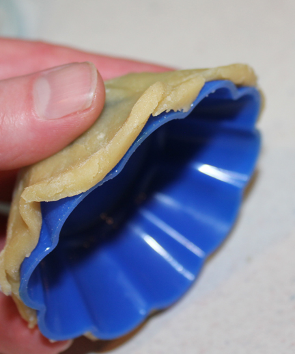 I used silicone cupcake pans to form my cups. Just press them around the outside and bake with the cups upside down.