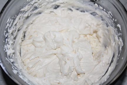 While the cupcakes are cooling, mix up your frosting. You'll need some vanilla (and you can use canned frosting for this or make your own. If you make your own, use  1 1/2 cups powdered sugar, 1/4 cup butter, 2 tbsp. milk and 1 tsp. vanilla. Blend together and set aside.