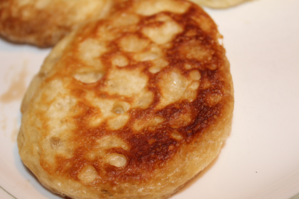 Eat them hot out of the pan with butter, top with some jam if you want a little sweetness to it. If you don't serve immediately, make sure you toast them before eating. They are much better warm than cold.