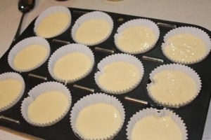 Make the cake mix according to package directions. Fill paper-lined muffin cups about 3/4 of the way full of the cake batter.