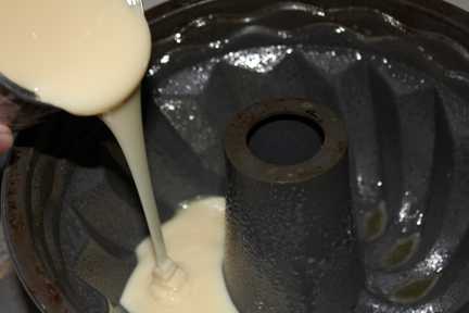 Pour the milk into a thoroughly greased bundt cake pan.
