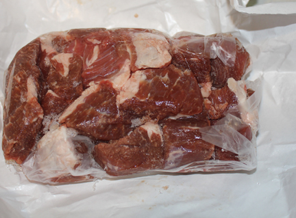 Take about two pounds of stew meat and trim off most of the fat, cutting it into bite-sized pieces.