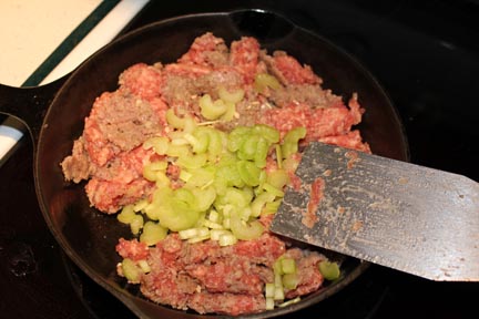 Brown sausage with celery and onion.
