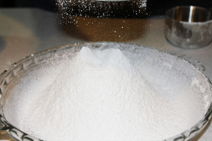 Alternate the two in your sifter  - it comes out beautifully.